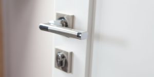 white door and metal handle